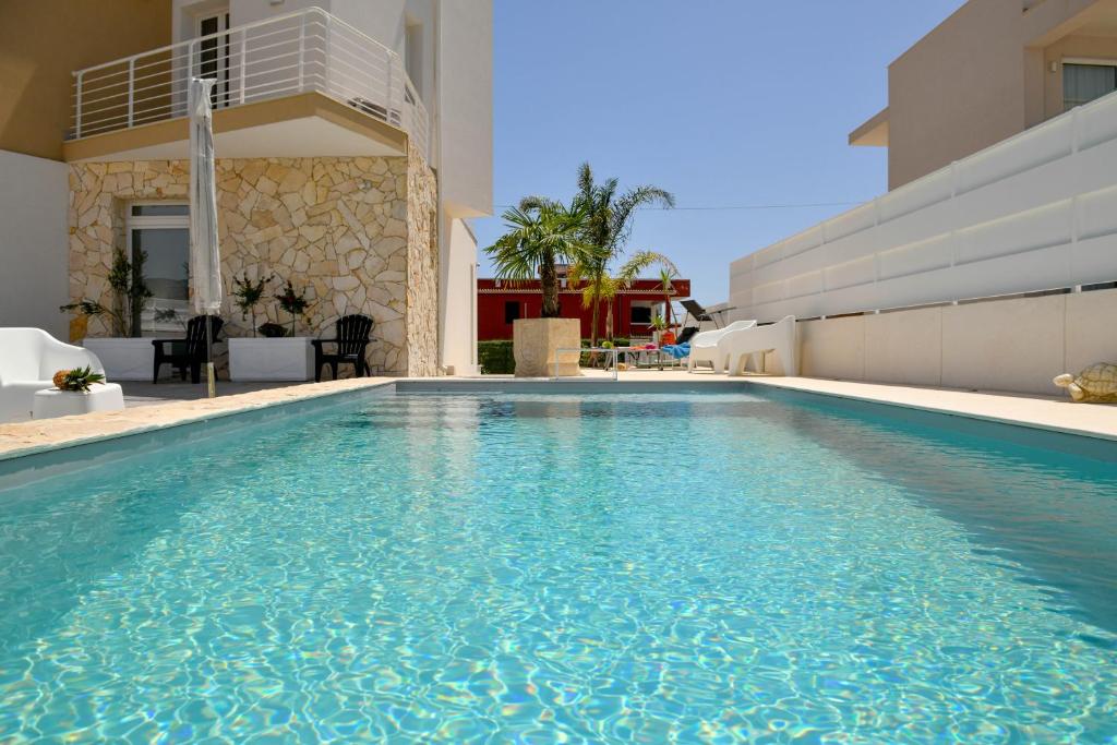 The swimming pool at or close to Villa Laura Charme Apartments