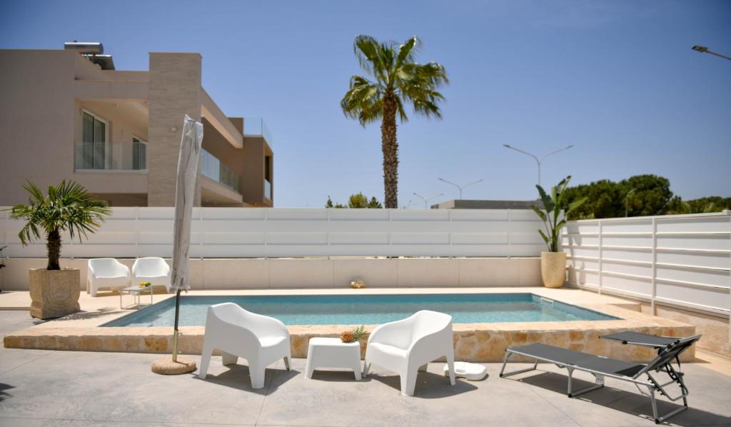 The swimming pool at or close to Villa Laura Charme Apartments