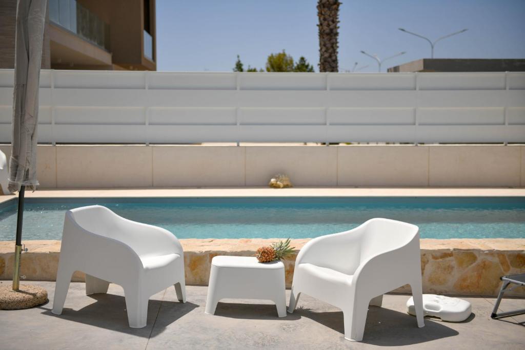 The swimming pool at or close to Villa Laura Charme Apartments