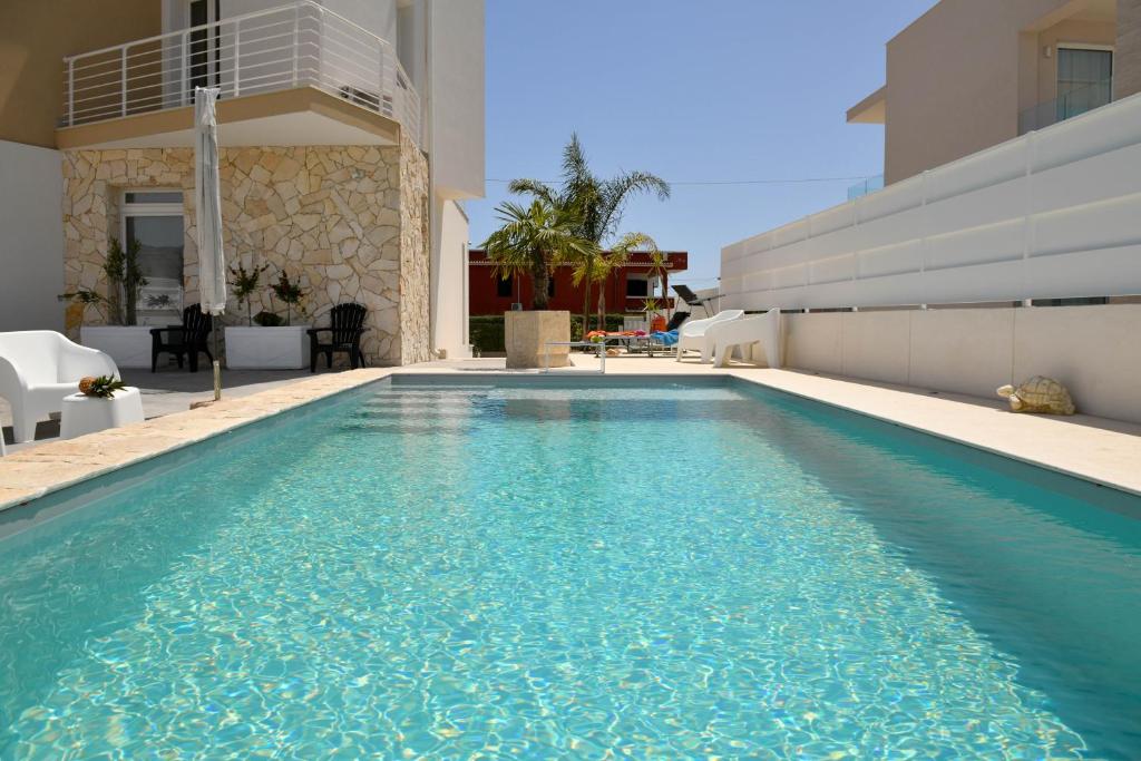 The swimming pool at or close to Villa Laura Charme Apartments