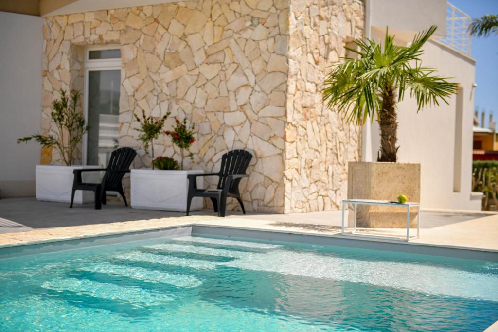 The swimming pool at or close to Villa Laura Charme Apartments