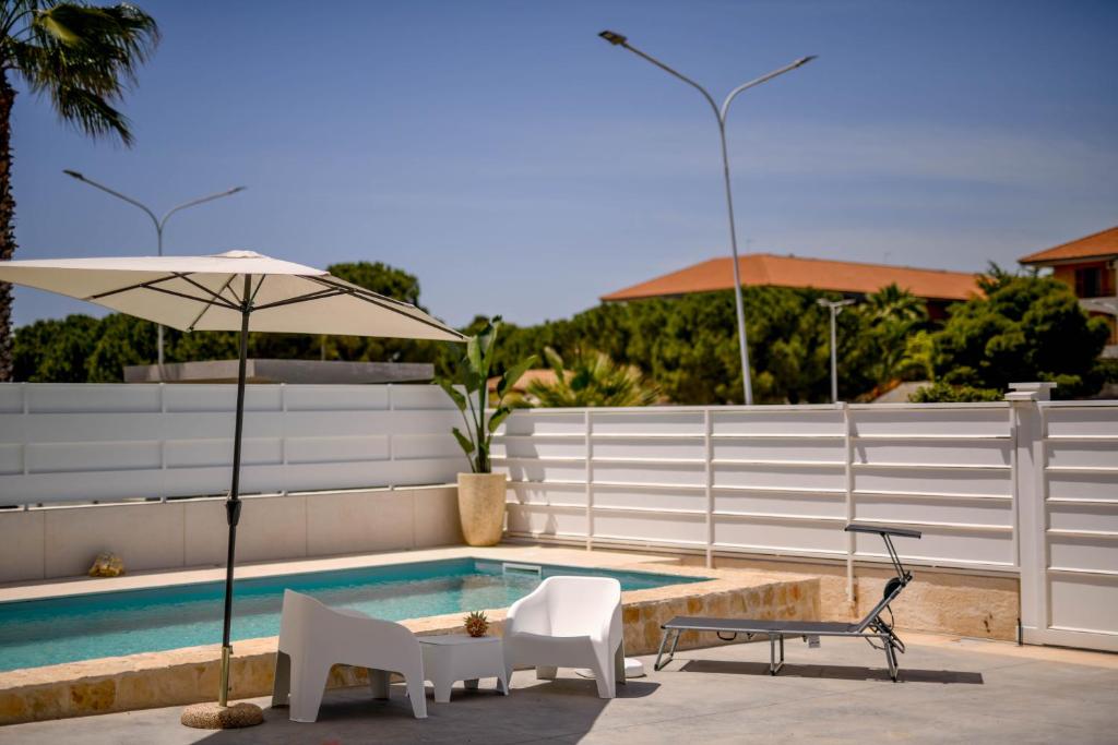 The swimming pool at or close to Villa Laura Charme Apartments
