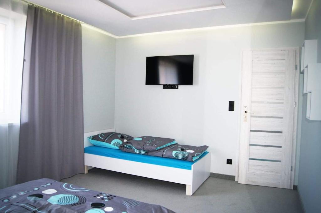 Posteľ alebo postele v izbe v ubytovaní Apartament U Bosmana
