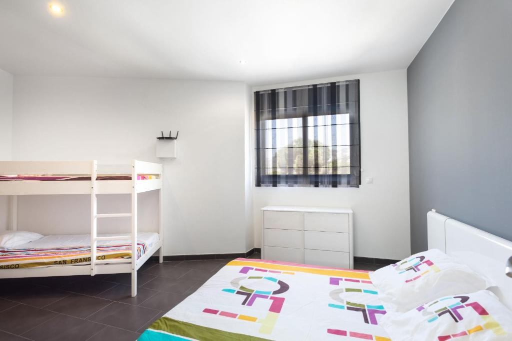 Postel nebo postele na pokoji v ubytování Villa Leeloo - Location Maitikoa