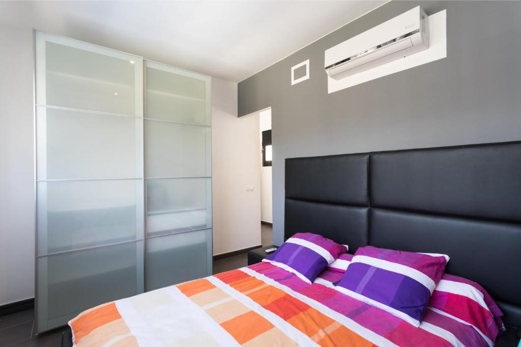 Postel nebo postele na pokoji v ubytování Villa Leeloo - Location Maitikoa
