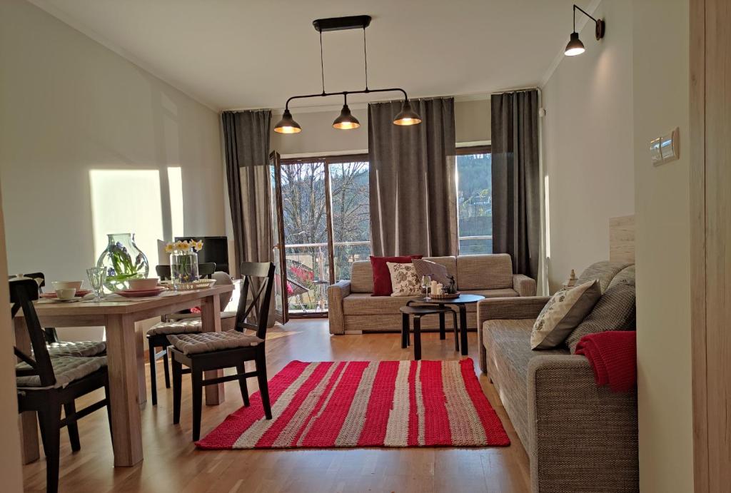 Posezení v ubytování Apartamenty Czerwone Maki Wisła
