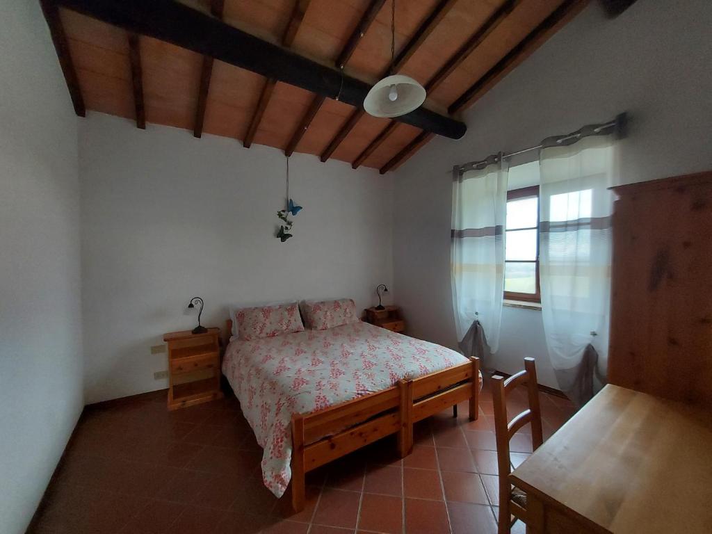 Postel nebo postele na pokoji v ubytování Agriturismo Capannacce