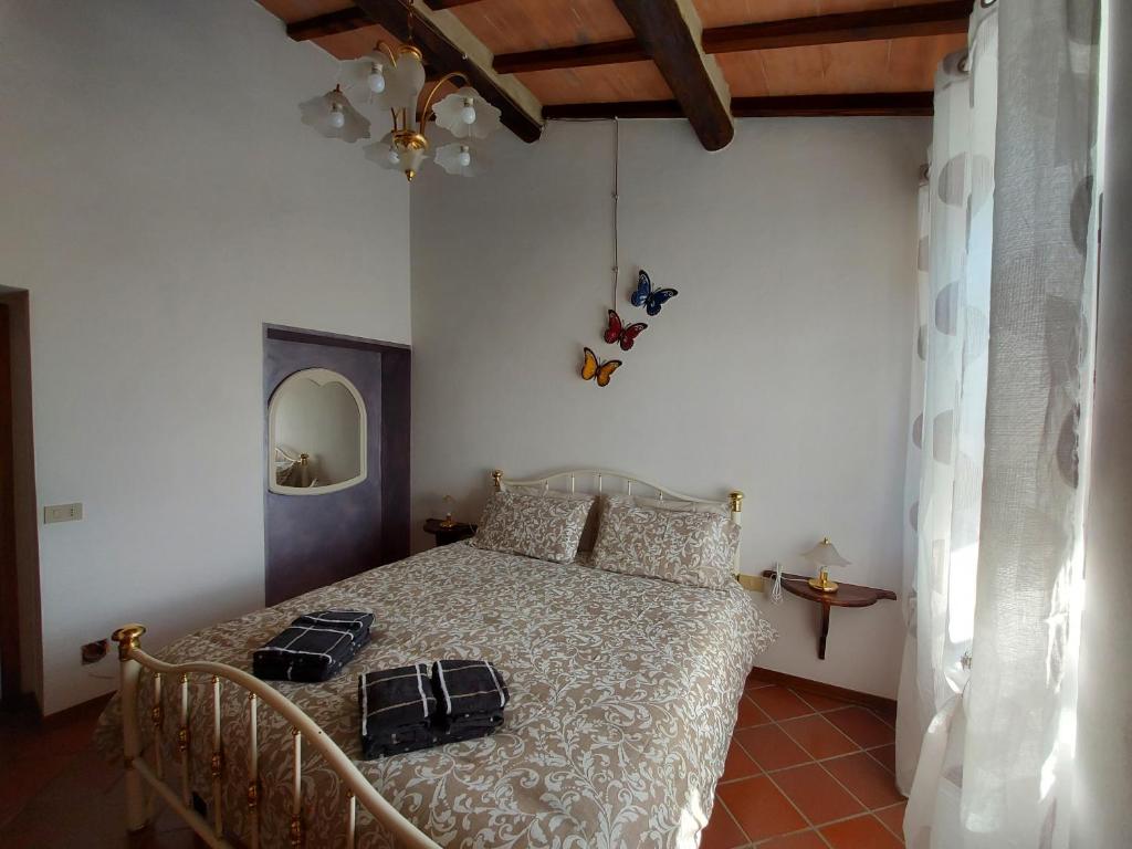 Postel nebo postele na pokoji v ubytování Agriturismo Capannacce