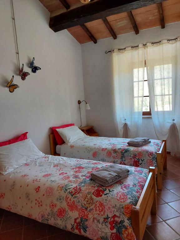 Postel nebo postele na pokoji v ubytování Agriturismo Capannacce