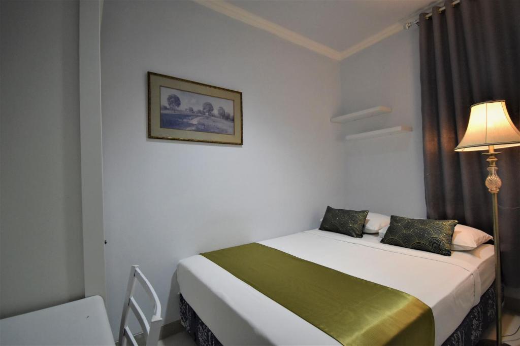 Postel nebo postele na pokoji v ubytování Nest Residence