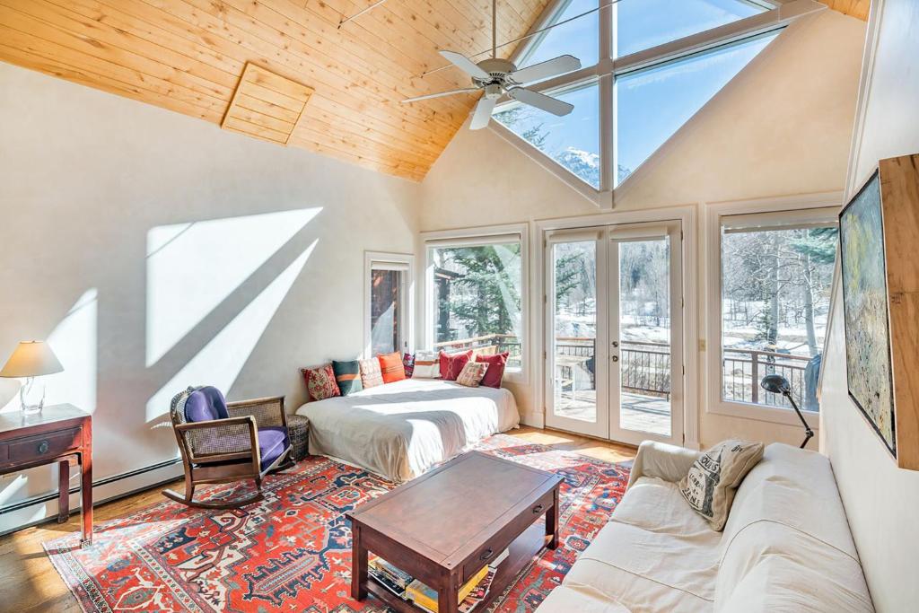 a living room with a bed and a table at Colorado East 735 - Idlewood East in Telluride