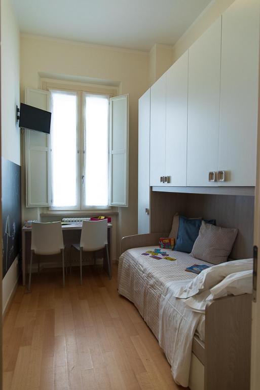 Posteľ alebo postele v izbe v ubytovaní Zara D'Amare a Pesaro 10 metri dalla spiaggia by Yohome