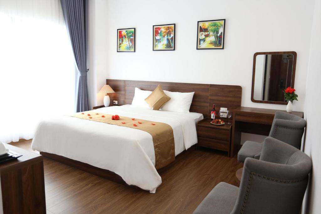 Giường trong phòng chung tại Silk River Hotel Ha Giang