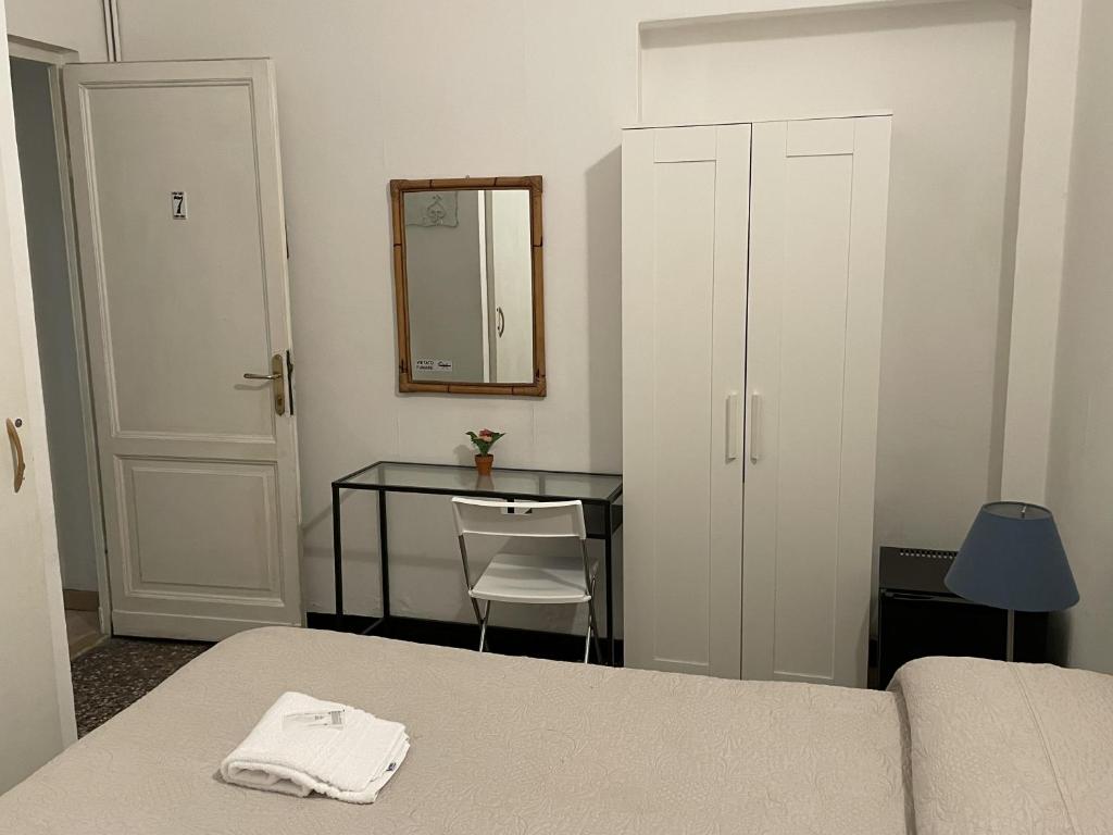 Łóżko lub łóżka w pokoju w obiekcie Albergo Novecento