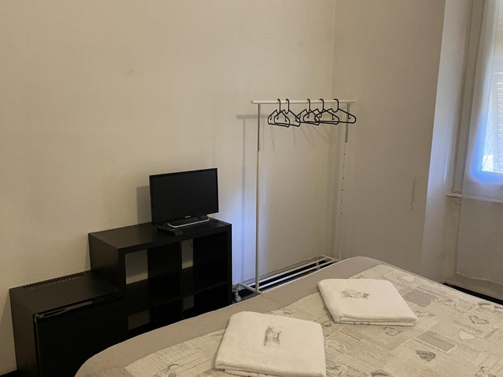 Łóżko lub łóżka w pokoju w obiekcie Albergo Novecento