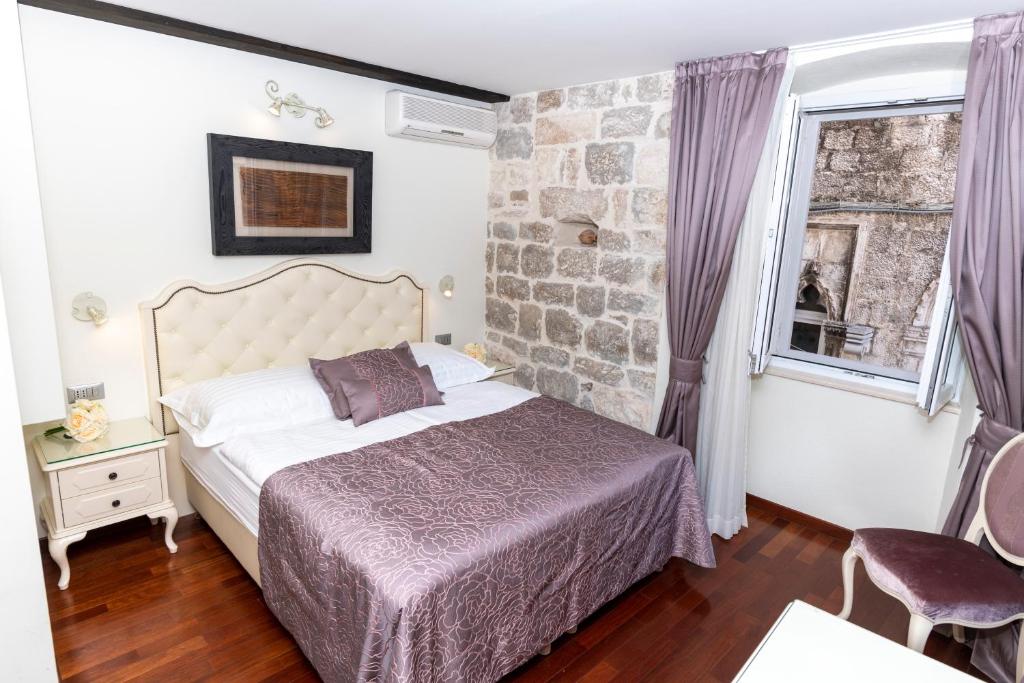 Postel nebo postele na pokoji v ubytování Deluxe Collection Hotel Kastel