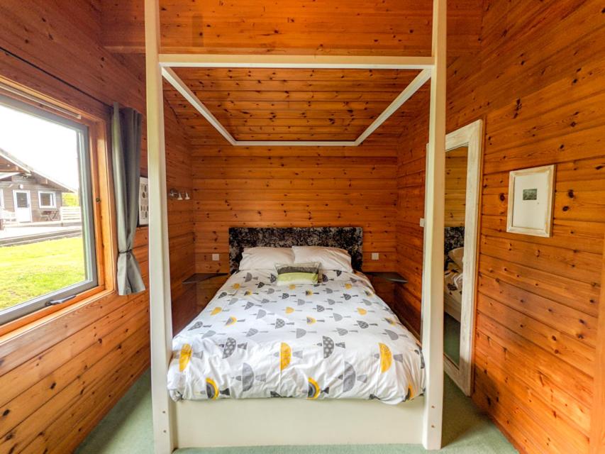 Postel nebo postele na pokoji v ubytování Avallon Lodges