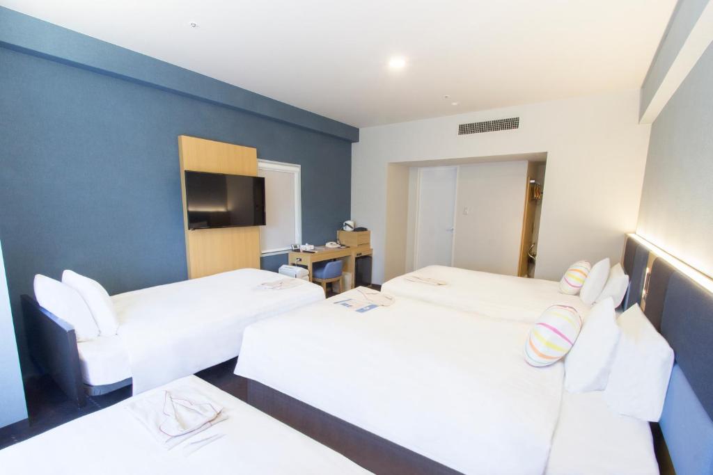 Postel nebo postele na pokoji v ubytování Hearton Hotel Kyoto