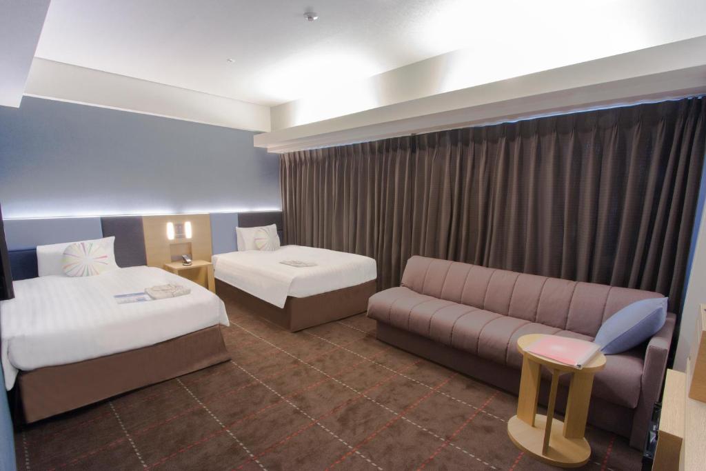 Postel nebo postele na pokoji v ubytování Hearton Hotel Kyoto