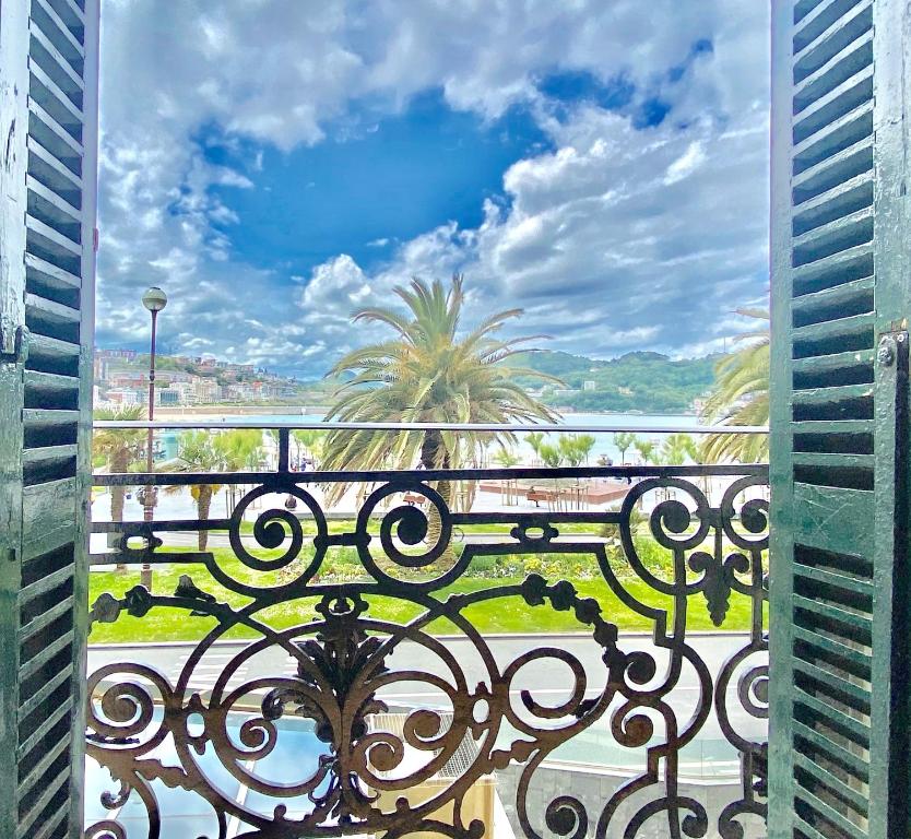 a view of a balcony with a view of the ocean at Mirandoalaconcha Rooms in San Sebastián