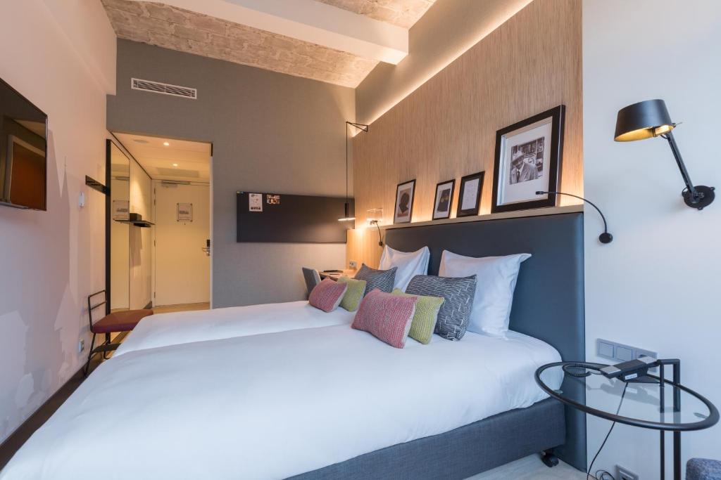 Postel nebo postele na pokoji v ubytování Postillion Hotel WTC Rotterdam