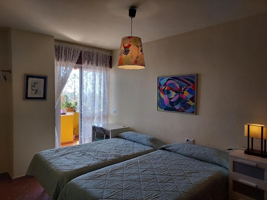 Posteľ alebo postele v izbe v ubytovaní Pedregalejo Room