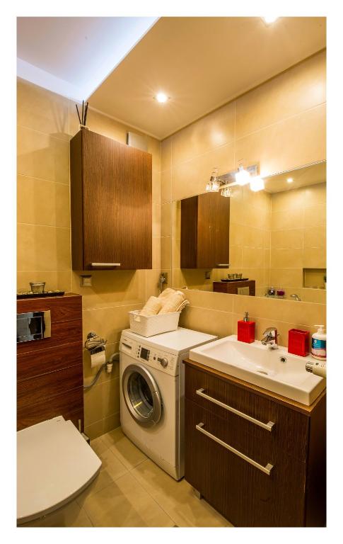 Posteľ alebo postele v izbe v ubytovaní Apartament Jantarowa