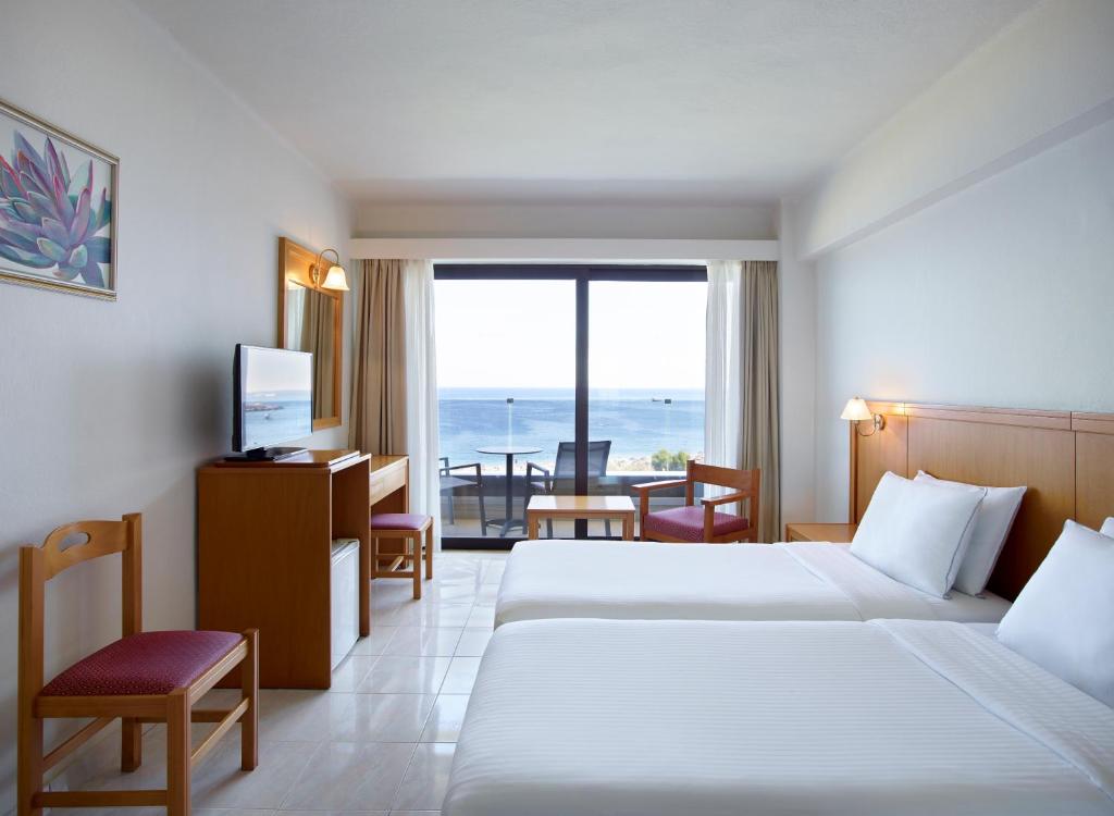 Posteľ alebo postele v izbe v ubytovaní Cactus Hotel