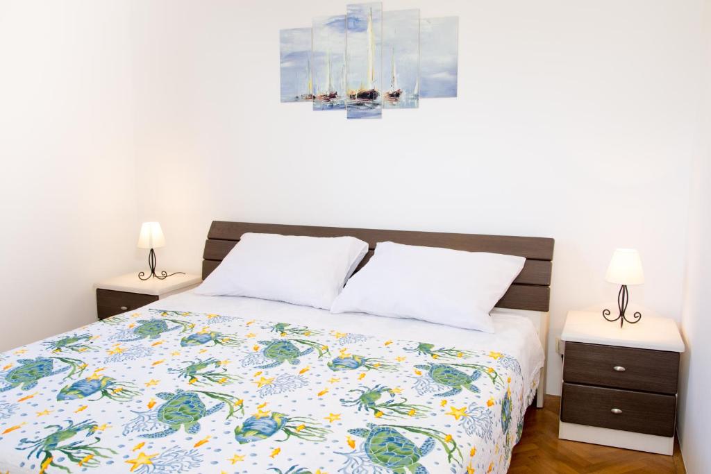Posteľ alebo postele v izbe v ubytovaní Carpe Diem Apartments