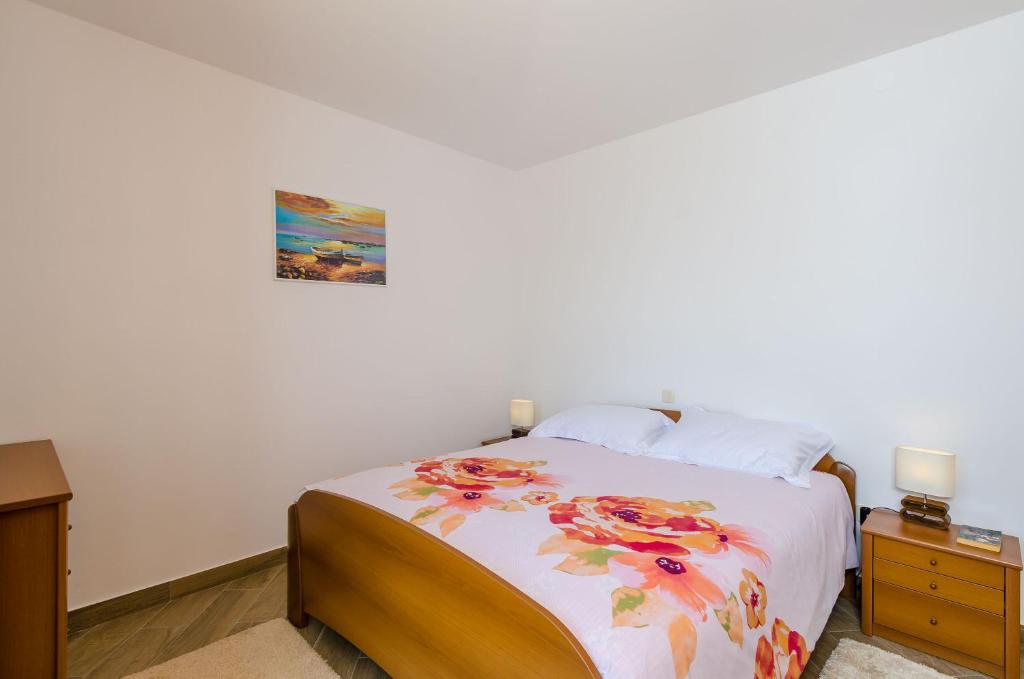 Posteľ alebo postele v izbe v ubytovaní Carpe Diem Apartments
