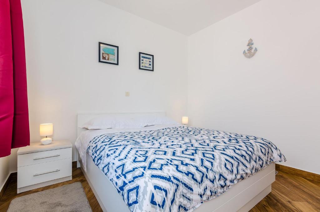 Posteľ alebo postele v izbe v ubytovaní Carpe Diem Apartments