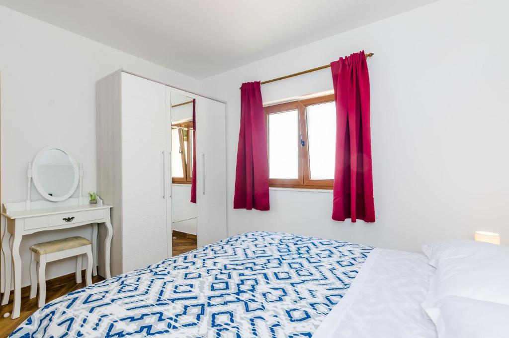 Posteľ alebo postele v izbe v ubytovaní Carpe Diem Apartments