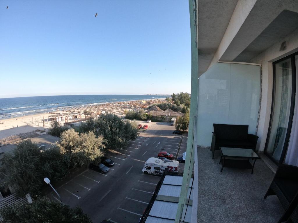 a balcony of a building with a view of the beach at Fancy Studio with Sea View in Mamaia