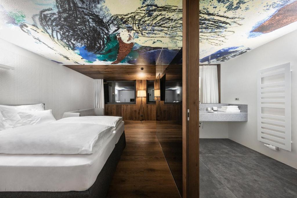 Postel nebo postele na pokoji v ubytování Ciasa de Munt Lifestyle Living