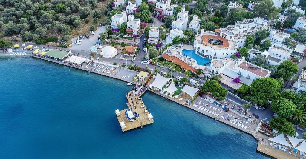 an aerial view of a pier in the water at Torbahan Boutique Hotel & Beach Club in Torba