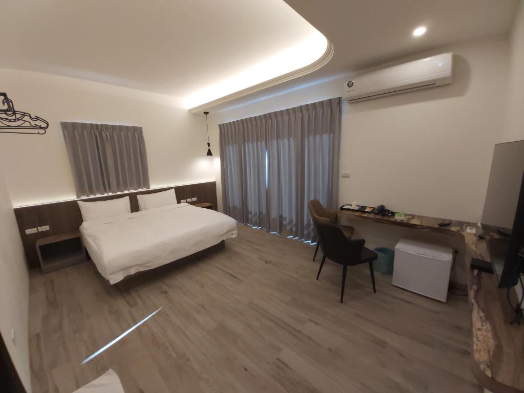 Postel nebo postele na pokoji v ubytování Blue Sea Stone Homestay
