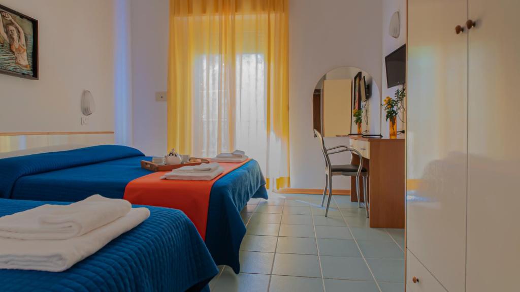 Postel nebo postele na pokoji v ubytování Hotel Plaza con piscina