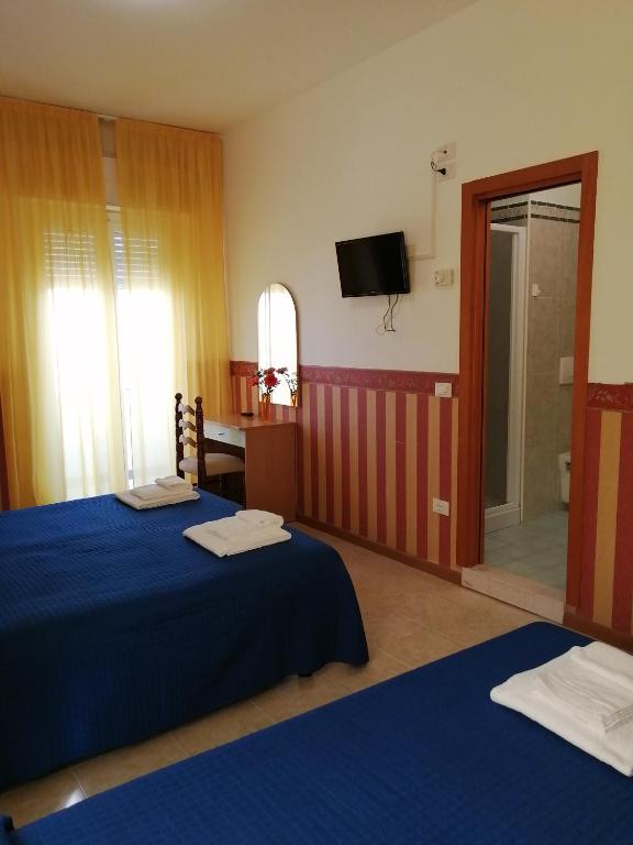 Postel nebo postele na pokoji v ubytování Hotel Plaza con piscina