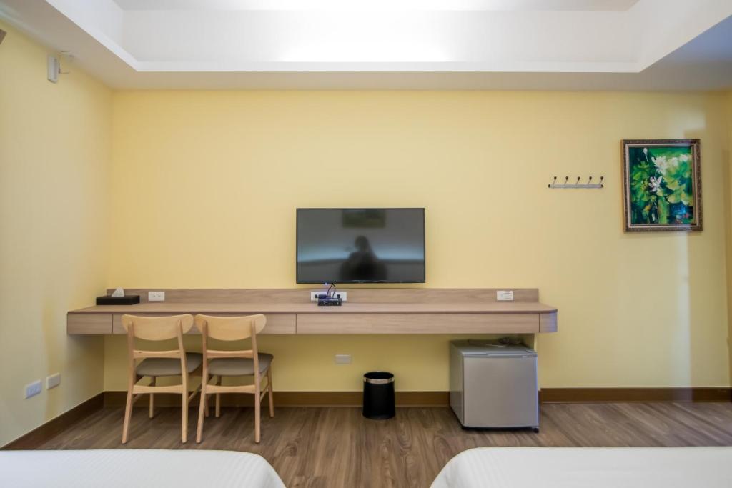 TV a/nebo společenská místnost v ubytování MuXia Fengqing Homestay
