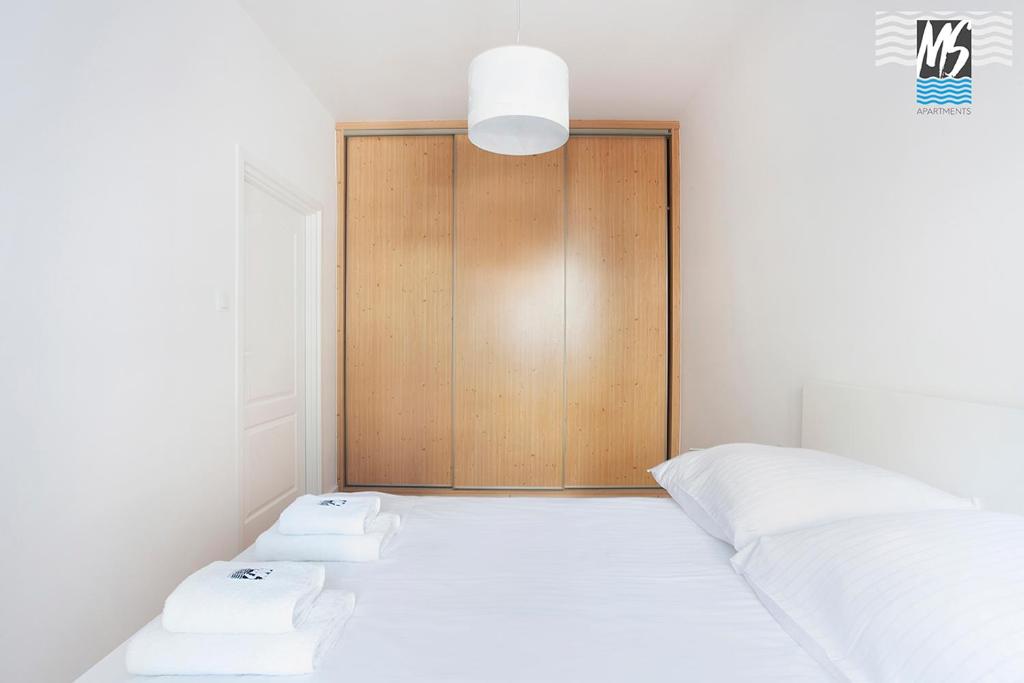 Posteľ alebo postele v izbe v ubytovaní MS Apartments Kopernicus II