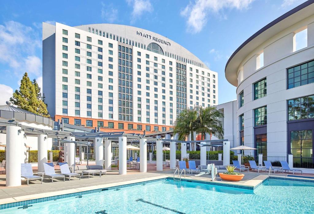 a hotel with a pool in front of a building at Hyatt Regency La Jolla at Aventine in San Diego