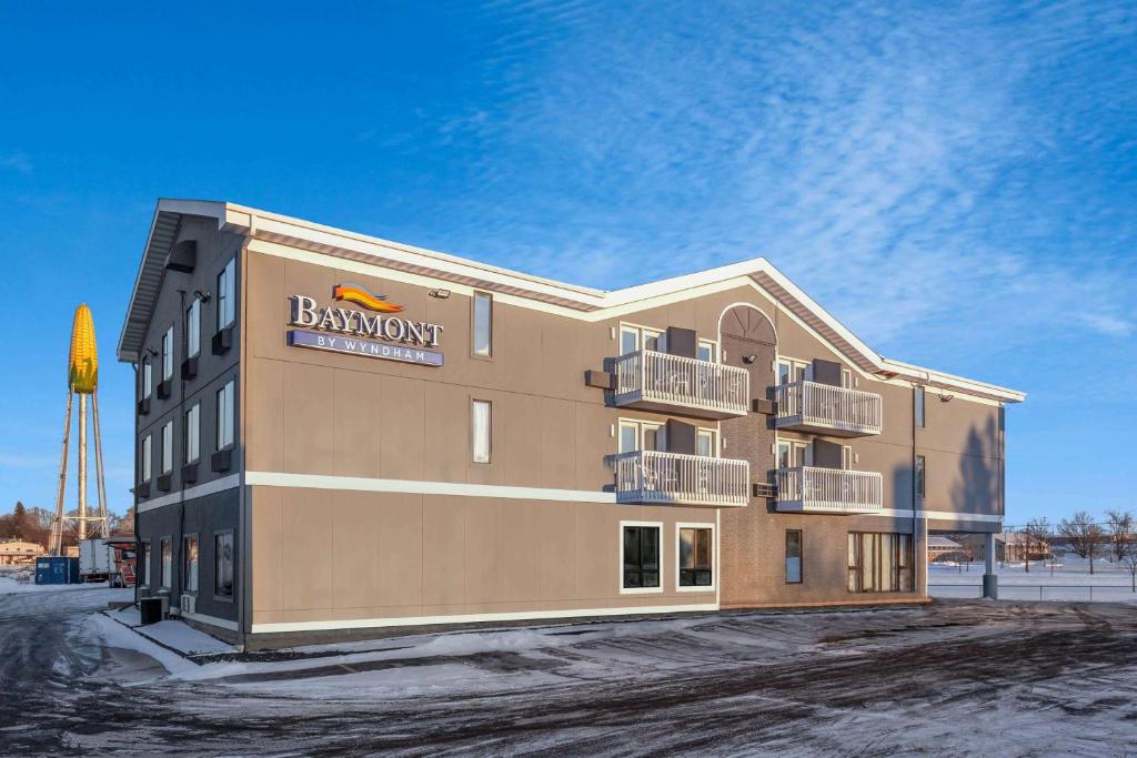 a building with a sign on the side of it at Baymont by Wyndham Rochester Mayo Clinic Area in Rochester