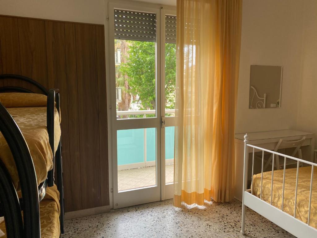 Postel nebo postele na pokoji v ubytování Hotel Modenese