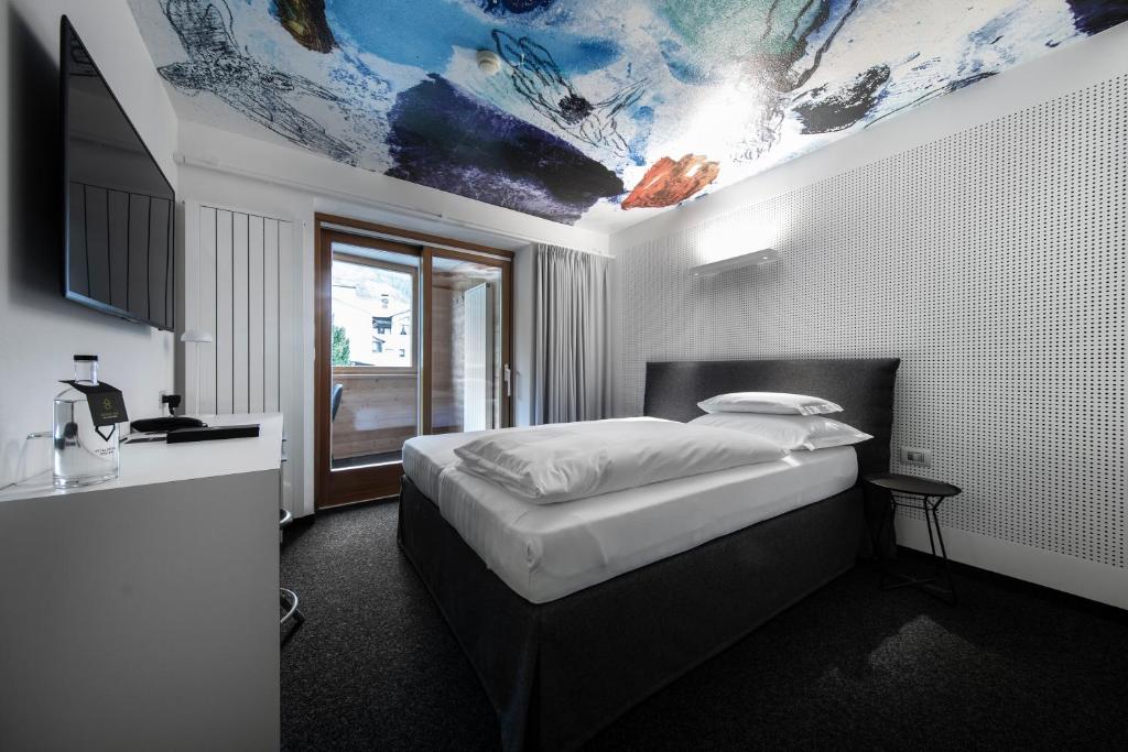 Postel nebo postele na pokoji v ubytování Ciasa de Munt Lifestyle Living