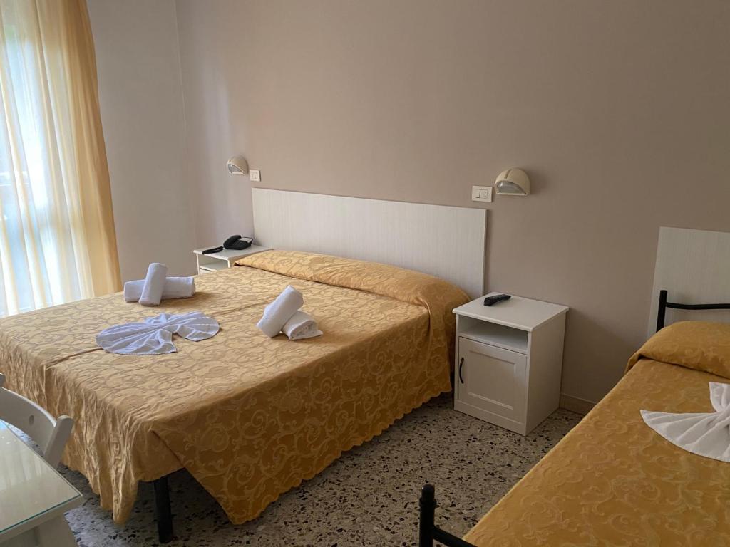 Postel nebo postele na pokoji v ubytování Hotel Modenese