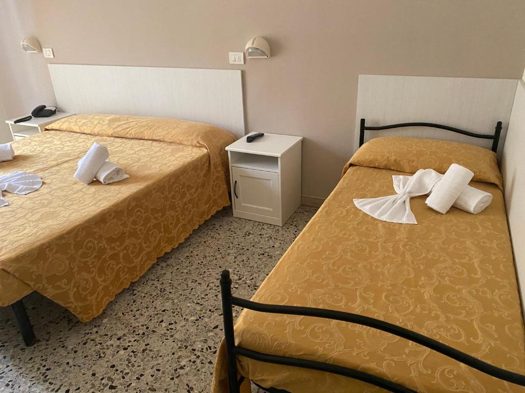 Postel nebo postele na pokoji v ubytování Hotel Modenese