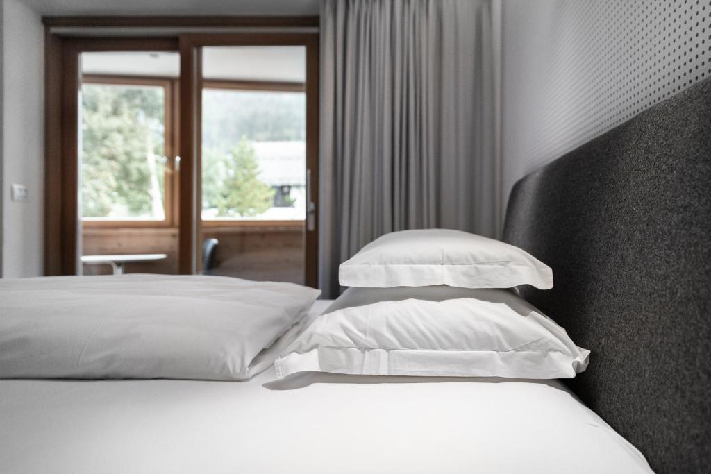 Postel nebo postele na pokoji v ubytování Ciasa de Munt Lifestyle Living
