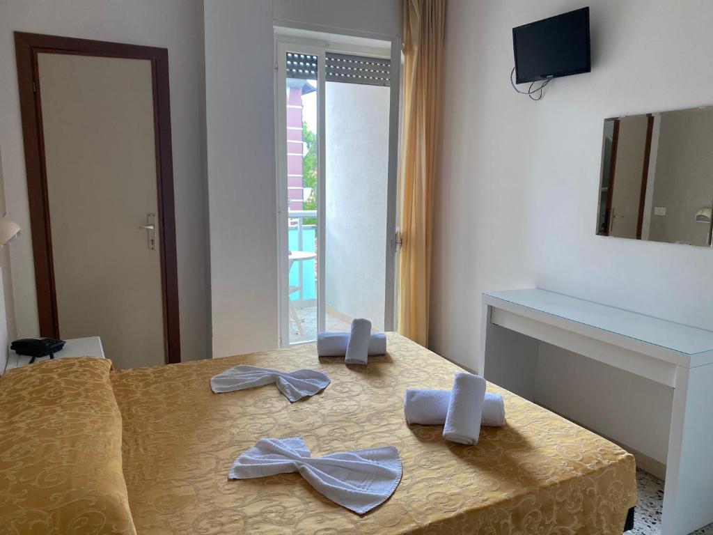 Postel nebo postele na pokoji v ubytování Hotel Modenese