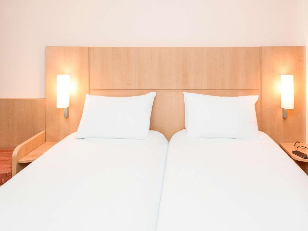 Postel nebo postele na pokoji v ubytování ibis Esch Belval