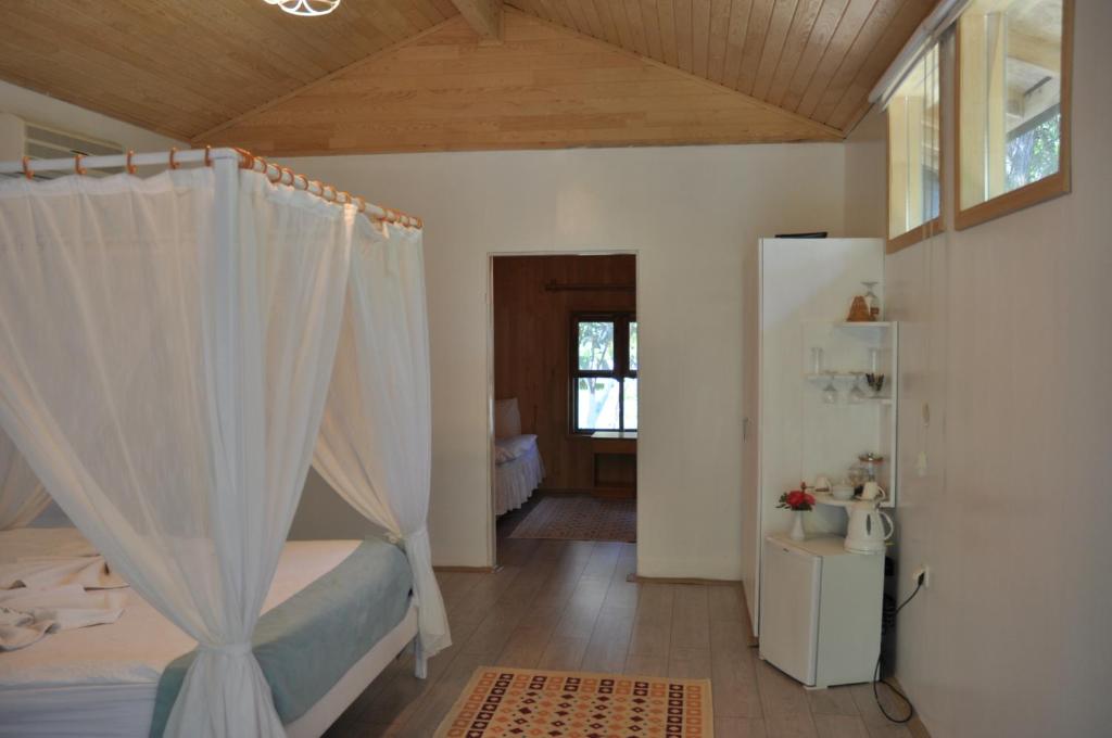 Postel nebo postele na pokoji v ubytování Bellerofon Beach Otel